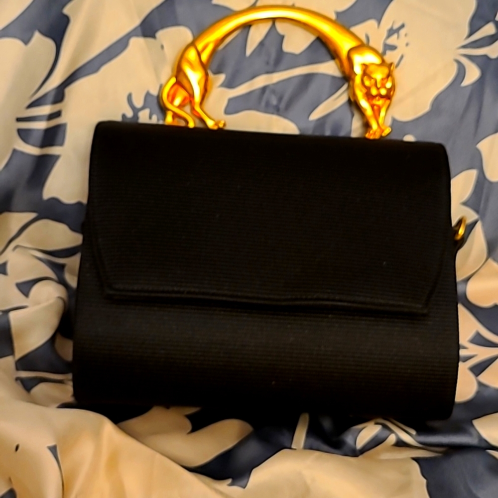 Woman's vintage Black cocktail purse with Gold Jaguar handle.